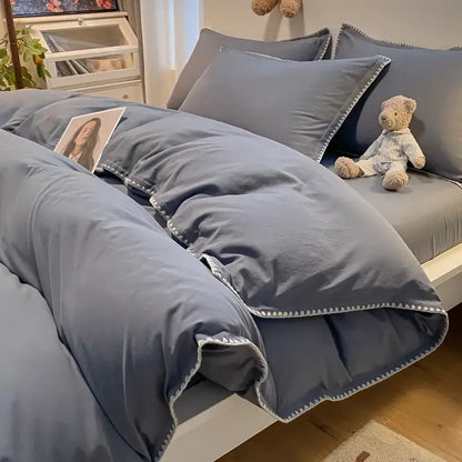 Gray quilted bedding set with subtle zigzag stitch trim and cozy shell edges for decorbites cozy shell bedroom decor