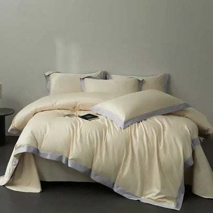 Cream-colored satin duvet cover set with soft gray piping trim in egyptian cotton hotel style bedding set