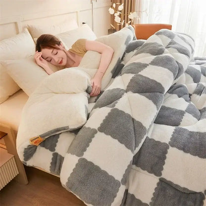 A cream and tan cozy checkerboard cashmere weighted blanket with a soft white and gray checkered pattern