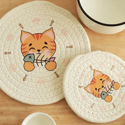 Cream braided rope cat print round coaster in cream quilted fabric featuring a cartoon orange tabby cat print fish bones