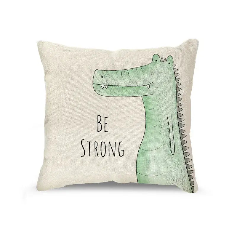 Cream cartoon animal linen pillowcase set with beige cushion featuring a light green crocodile and be strong text decorbites cartoon animal