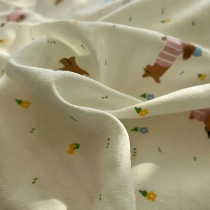 Cream soft fabric bedding set featuring decorbites cartoon pattern of dachshunds and colorful flowers for bedroom decor