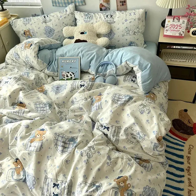 Soft cream bedding set with decorbites cartoon pattern featuring teddy bears, plaid pockets, and delicate blue accents