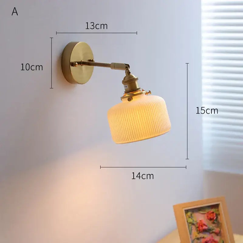 Brass-finished led wall sconce with ribbed warm-toned glass shade and copper arm from decorbites ceramic led collection