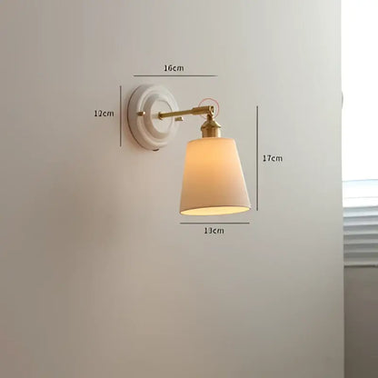 Cream ceramic led wall light with copper arm and beige fabric shade by decorbites ceramic led for bedroom sconce decor