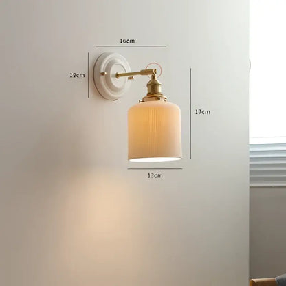 Vintage-style cream ceramic led wall light with copper arm and off-white ribbed glass shade by decorbites ceramic led