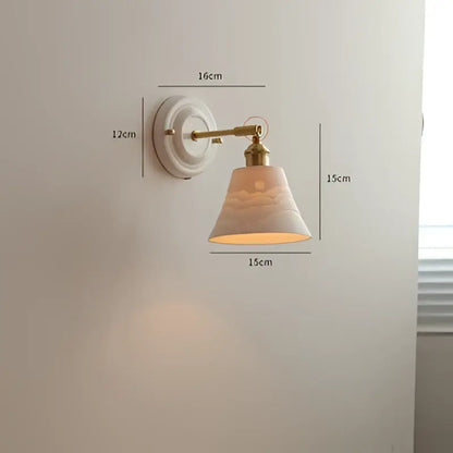 Cream ceramic led wall light with copper arm and decorative cloud motif shade for bedroom decorbites ceramic led use