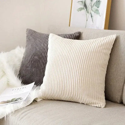 Cream corduroy striped cushion cover with ribbed texture resting on beige sofa for decorbites corduroy striped decor