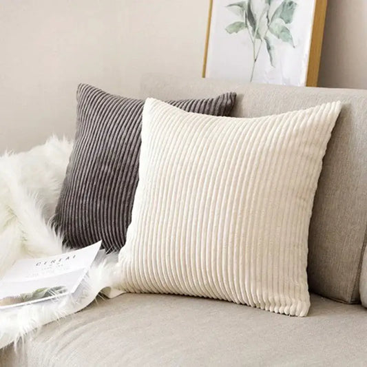 Cream corduroy striped cushion cover with ribbed texture resting on beige sofa for decorbites corduroy striped decor