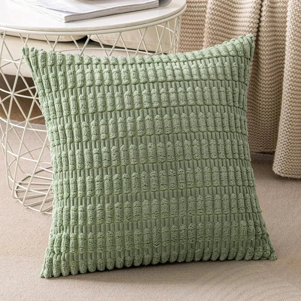 A soft sage green textured throw pillow with raised woven pattern for decorbites corduroy striped pillow covers