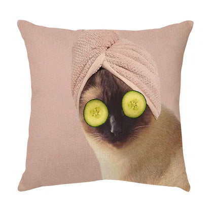 Cream soft pink linen throw pillow with a cute cat face decorative print of a siamese cat wearing cucumber slices and towel
