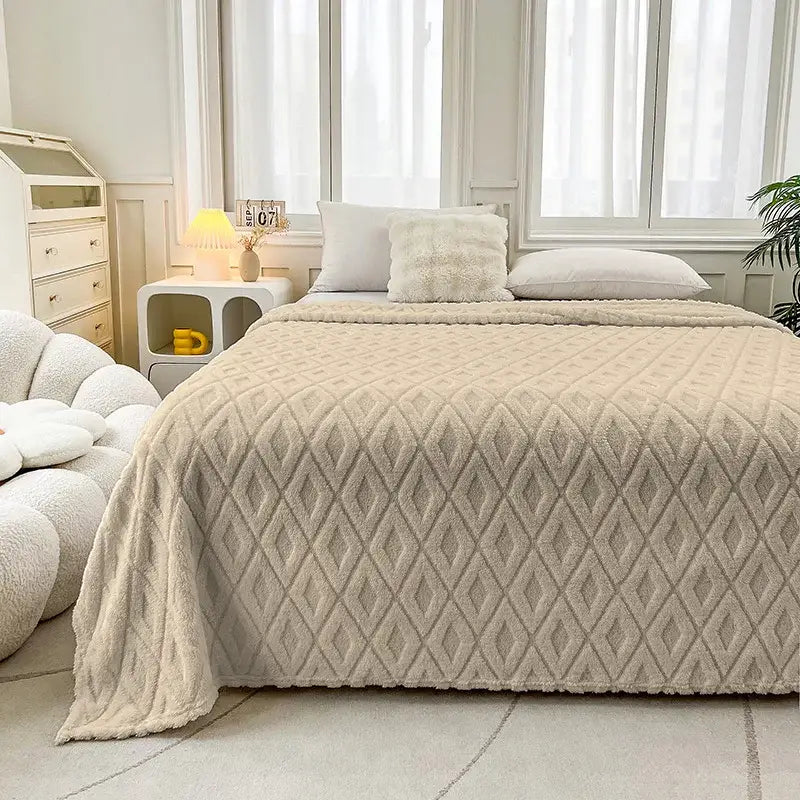 Beige diamond quilted fleece blanket with soft plush texture made of jacquard coral fleece for cozy bedroom throw