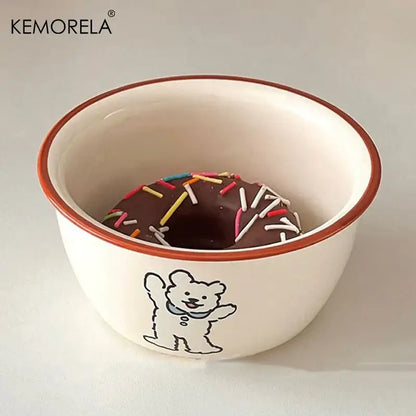 White ceramic soup bowl with a brown rim and a black bear illustration holding a chocolate donut decorbites carton ceramic