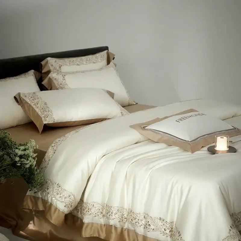 Cream embroidered egyptian cotton bedding set in cream satin with beige floral embroidery and ruffled edges