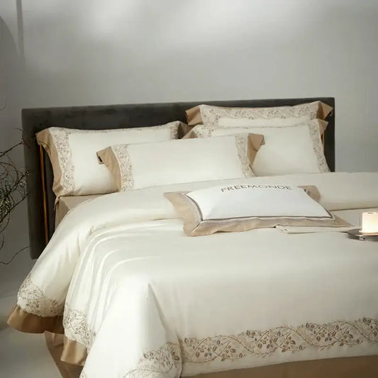 Cream embroidered egyptian cotton bedding set featuring a cream satin duvet cover with beige floral embroidery and matching pillowcases