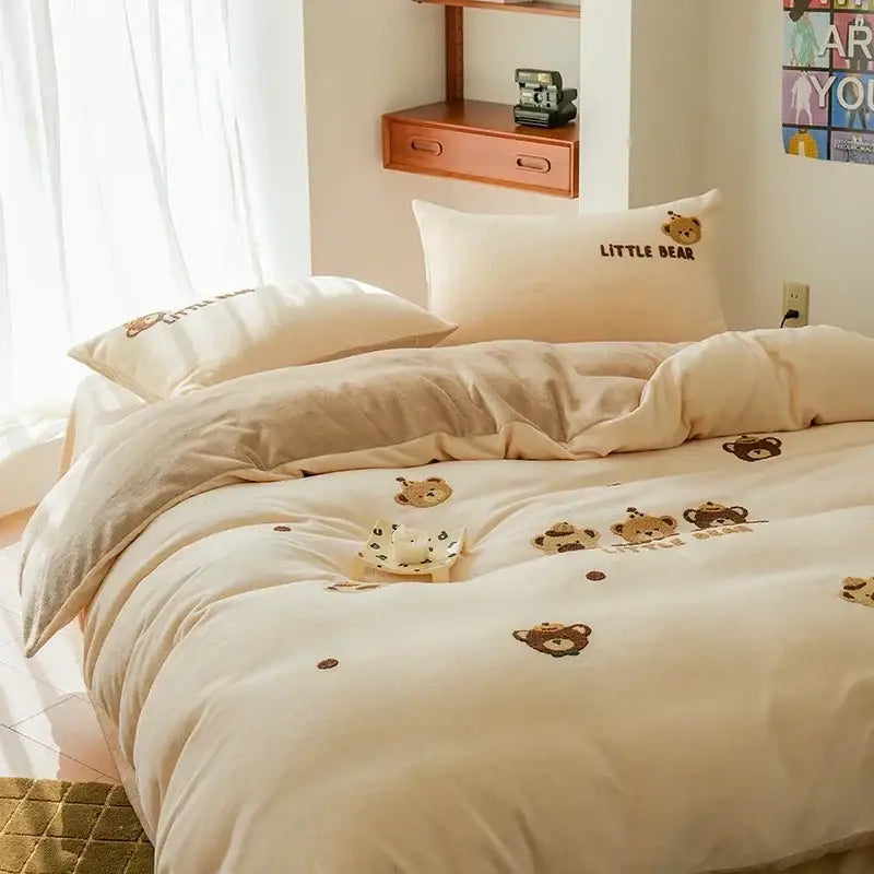 Cream embroidered milk fleece bedding set with plush cream duvet and pillows featuring brown bear faces and text little bear