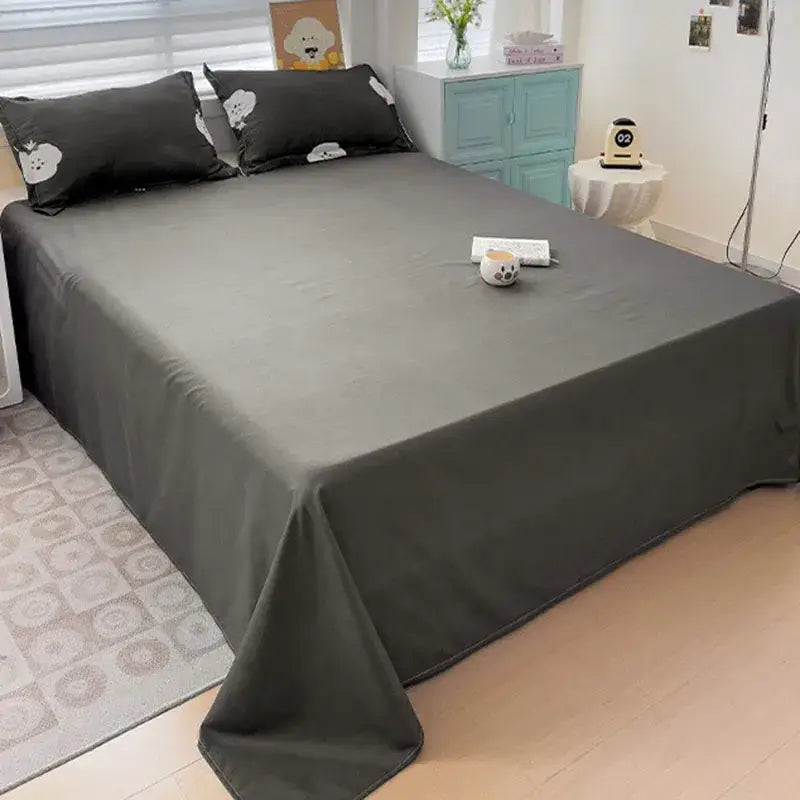 Dark gray smooth textured bedding set with black pillows featuring white cartoon dog faces cream floral cartoon printed decorbites cartoon printed cartoon printed bedding
