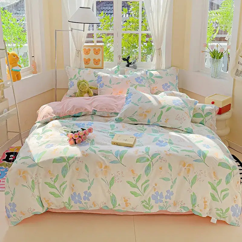 Pastel floral decorbites cartoon printed bedding set with soft green blue and yellow blossoms on creamy background
