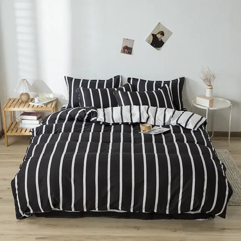 Black and white vertically striped quilted bedding set complementing cream floral decorbites cartoon printed bedding with green accents
