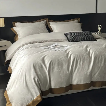 Cream floral jacquard bedding set featuring cream satin duvet cover with subtle floral embroidery and gold-toned trim