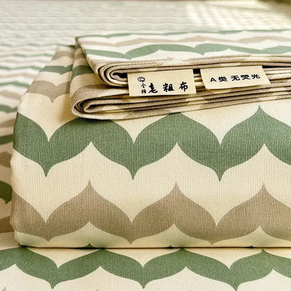Folded cream flower print satin bed cover with chevron pattern in green and beige woven texture for decorbites cooling cotton