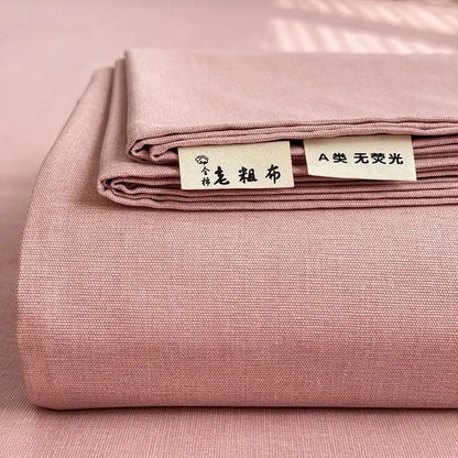 A soft pink textured cotton bed cover with subtle woven pattern designed for decorbites cooling cotton mattress use