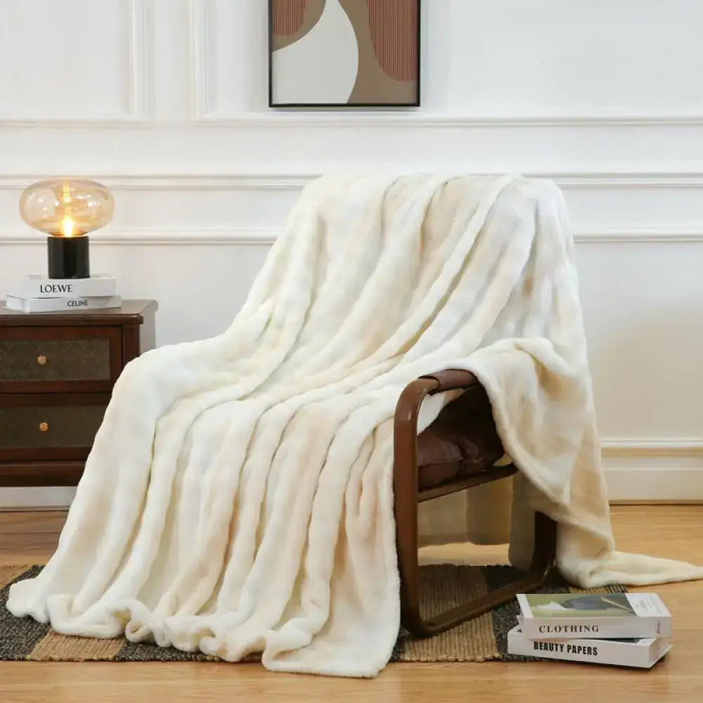 Cream fuzzy faux fur blanket draped over wooden chair soft plush decorbites fuzzy faux throw for bedroom and living room decor