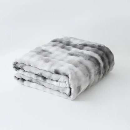 A gray and white mottled decorbites fuzzy faux fur blanket with soft texture for bedroom and living room throw