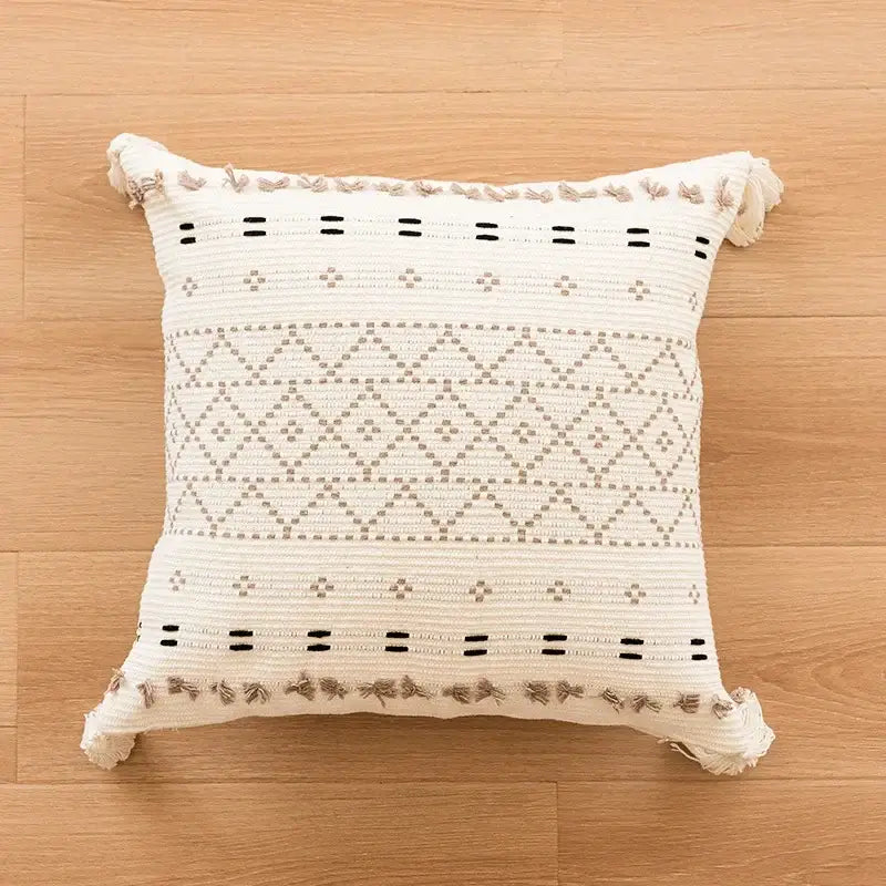 Cream pillow cover with decorbites geometric embroidered crocheted patterns and fringed edges for living room decor