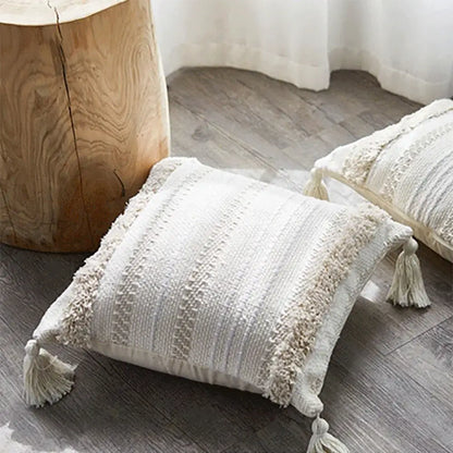 Cream cushion cover with geometric embroidery featuring textured stripes and tassels for living room decorbites design