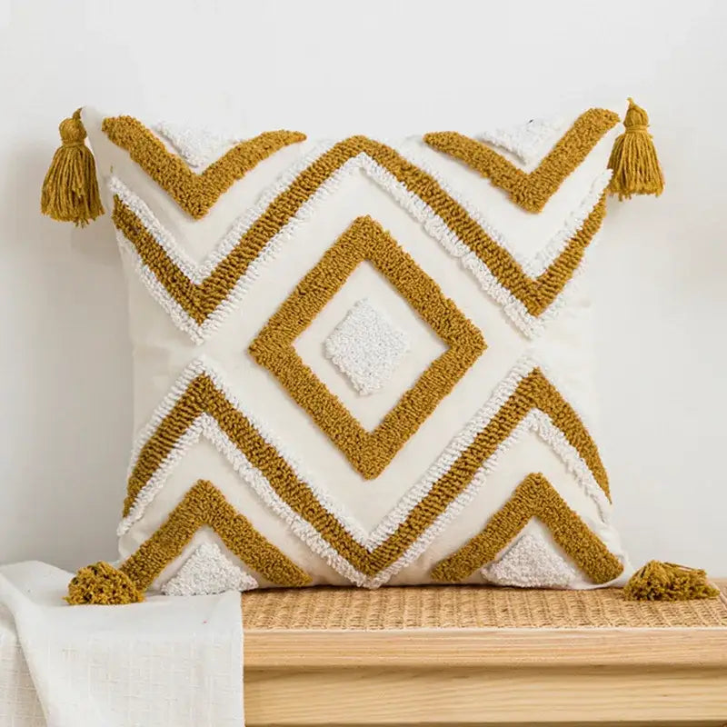 Cream cushion cover with mustard-yellow geometric embroidery and textured tassels for living room decorbites decor
