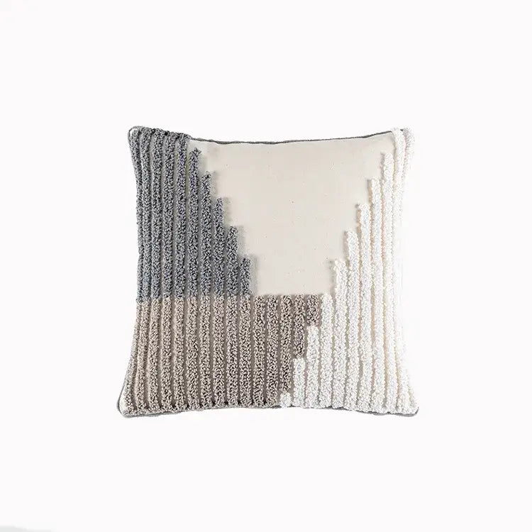 Cream cushion cover with geometric embroidery featuring textured layered arc designs in gray and white decorbites style