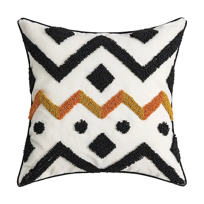 Cream geometric embroidery cushion cover with black and orange zigzag patterns made of textured plush fabric by decorbites geometric embroidery