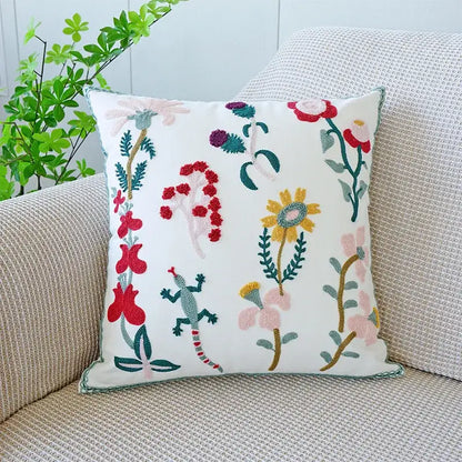Cream green tulip embroidery cushion cover with white base featuring colorful flowers and a decorbites green lizard design