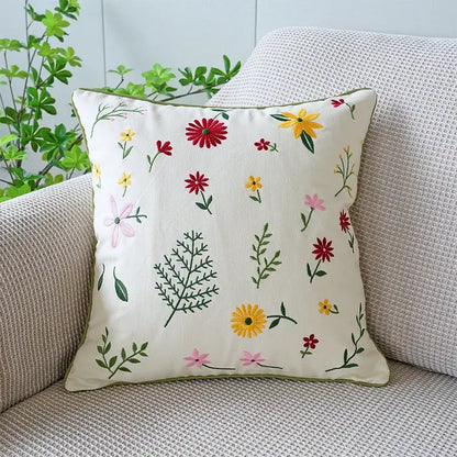 Cream-colored living room cushion cover with decorbites green tulip embroidery of colorful flowers and greenery