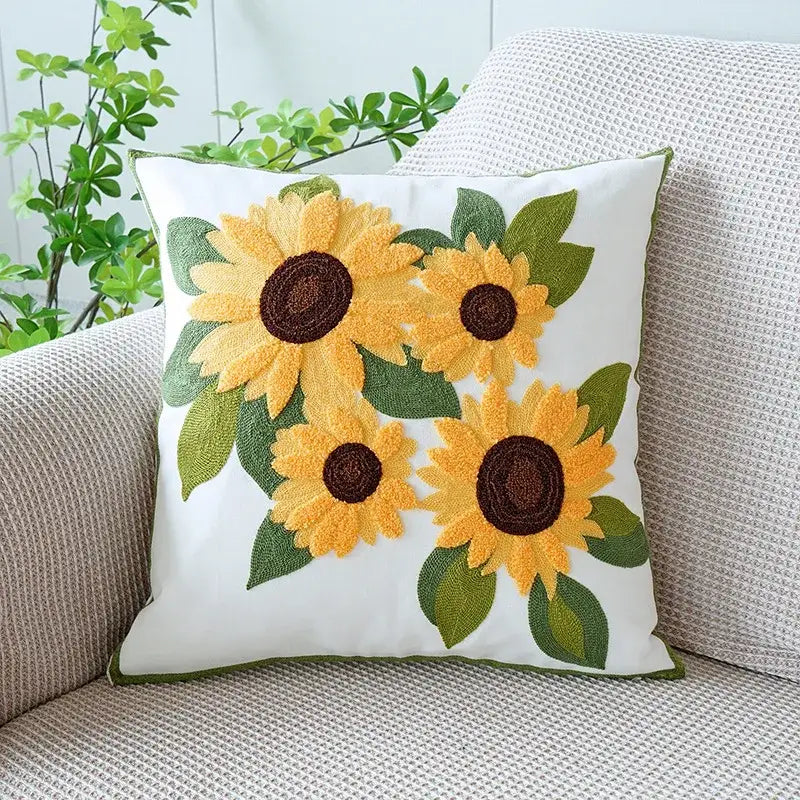 Cream green tulip embroidery cushion cover with white fabric, embroidered sunflowers, and decorbites green tulip border