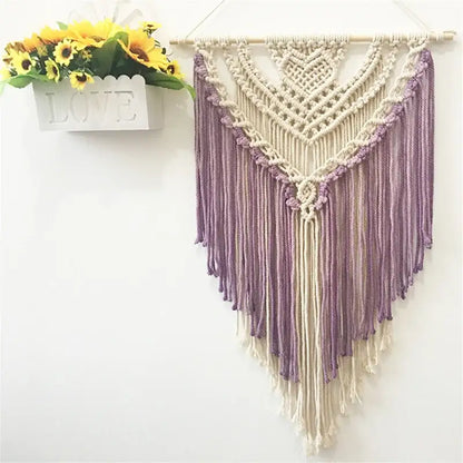A delicate cream and lavender macrame wall hanging made of colorful cotton for living room decor by decorbites