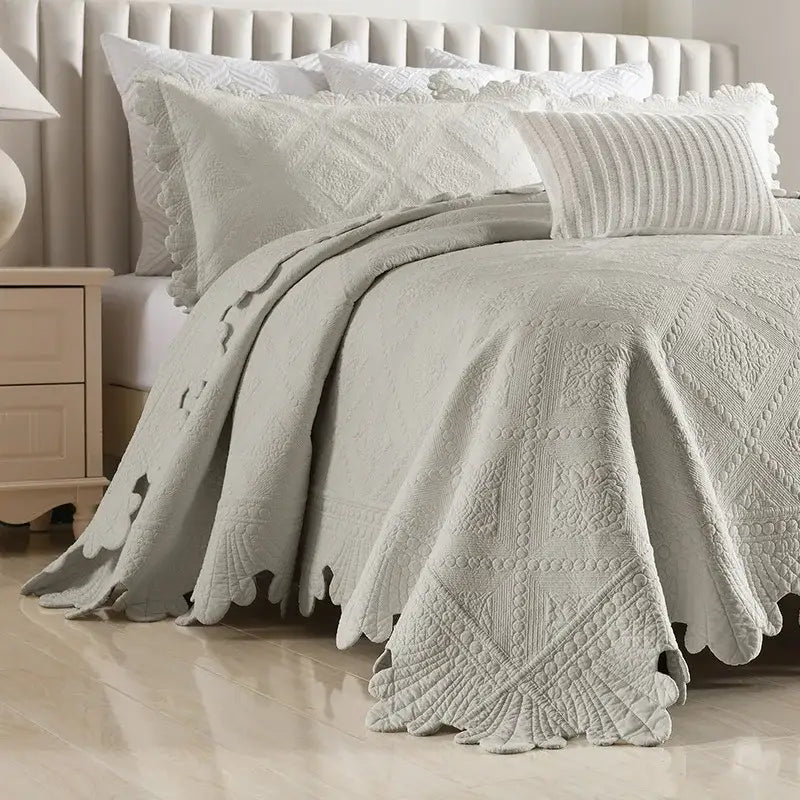 Cream scalloped diamond cotton embroidery quilt set featuring a soft light gray quilted bedspread with geometric patterns