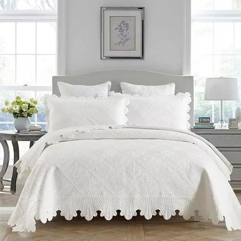 Cream scalloped diamond cotton embroidery quilt set featuring a white quilted bedspread with scalloped edges