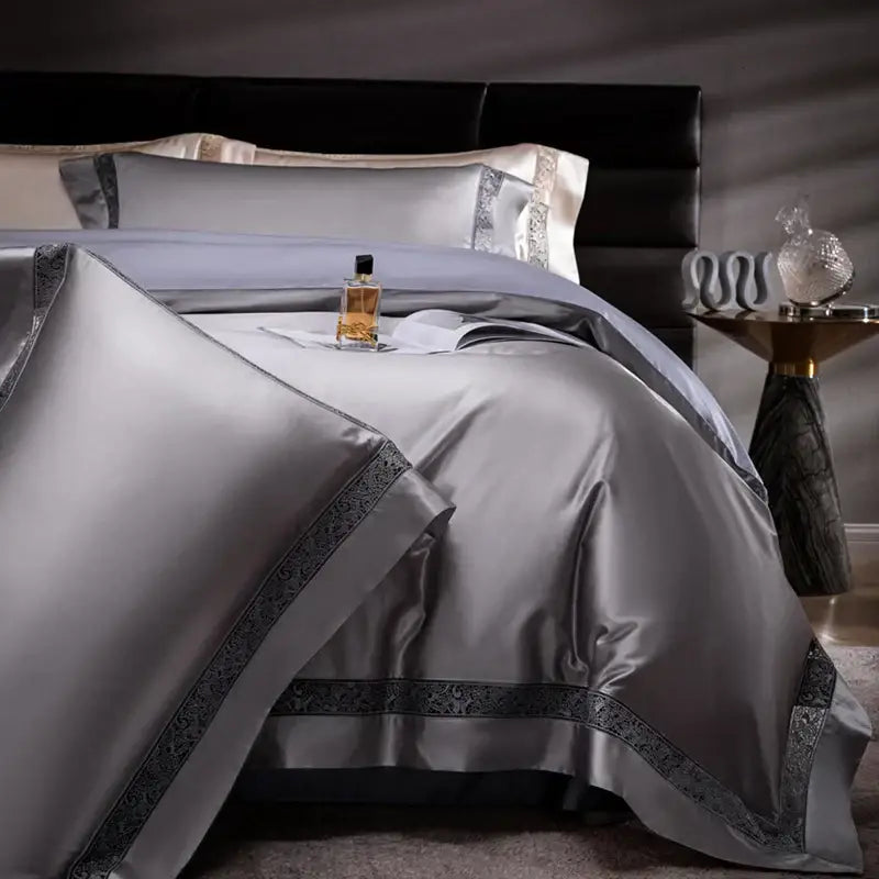 Silver satin bedding set with intricate dark gray embroidered trim in cream and silver decorbites damask lyocell cotton design