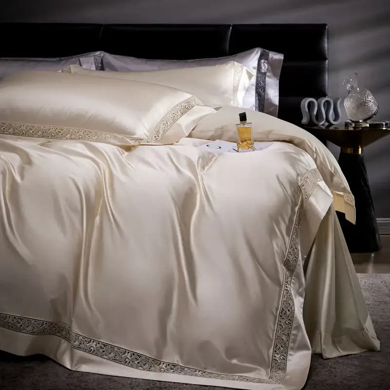 Cream-colored satin bedding set with elegant silver lace trim made from decorbites damask lyocell cotton