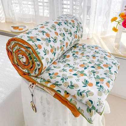 A cozy cream teddy bear double layered soya fibre quilt with citrus pattern and orange inner lining for bedroom comfort