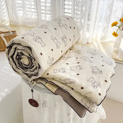 Cream teddy bear double layered soya fibre quilt in soft cream with black bear pattern and dark gray border for bedroom comfort