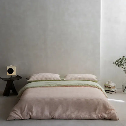 Soft blush pink ribbed duvet cover bedding set with green accent stripe made from cotton foam yarn foam yarn bedding
