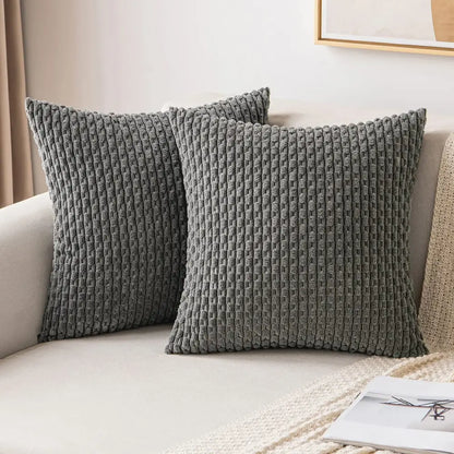 Two dark gray textured throw pillows with woven corduroy pattern on light sofa decorative pillow cover decorbites