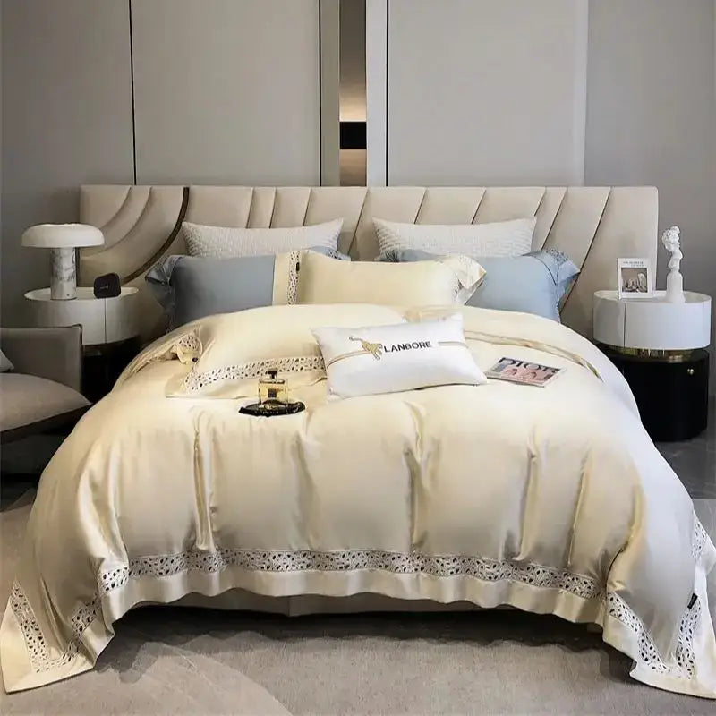 Cream-colored satin bedding set with eucalyptus fiber featuring delicate white lace trim and embroidered pillows by decorbites eucalyptus fiber