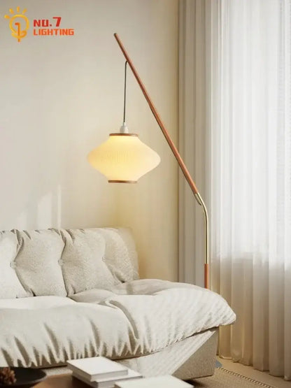 Cream wind acrylic amber glass floor lamp with curved wooden and brass stand and illuminated ribbed off-white shade for living room decorbites cream wind floor lamp