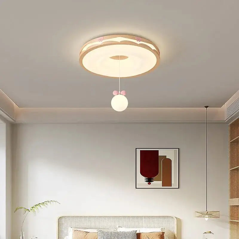 Cream wind walnut round bedroom light features a beige and white ceiling fixture with a pink bow hanging bulb decorbites cream wind