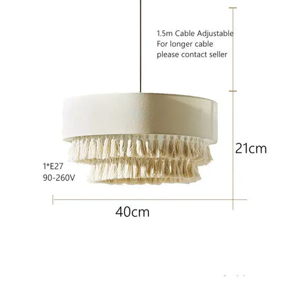 Cream-colored cylindrical pendant light with layered tassels perfect for bedroom decorbites creamy bohemian style
