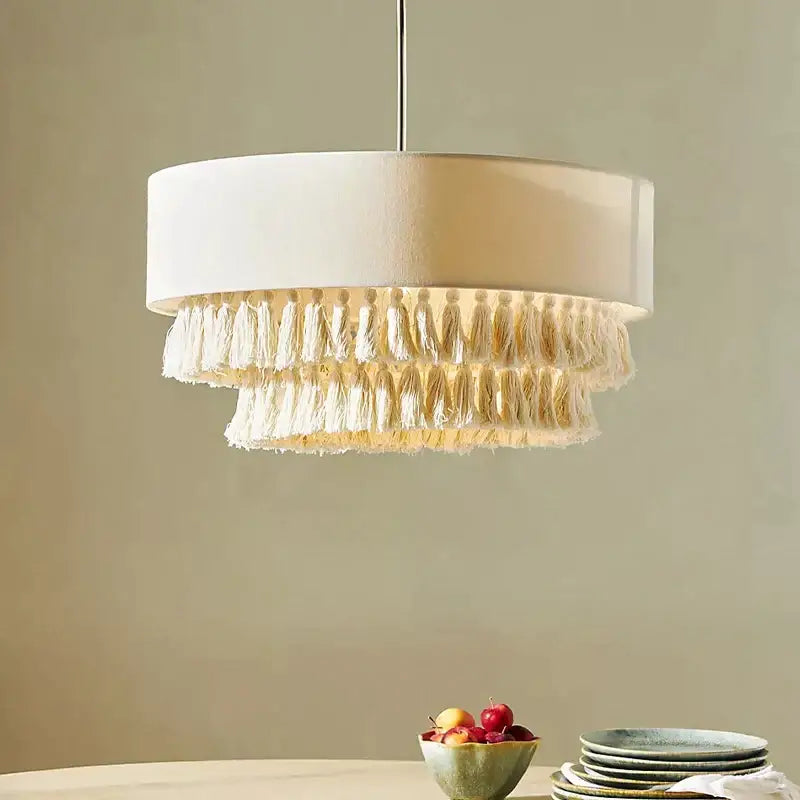 Cream bohemian wabi sabi tassel pendant light with white cylindrical shade and cream tassels for bedroom decorbites decor